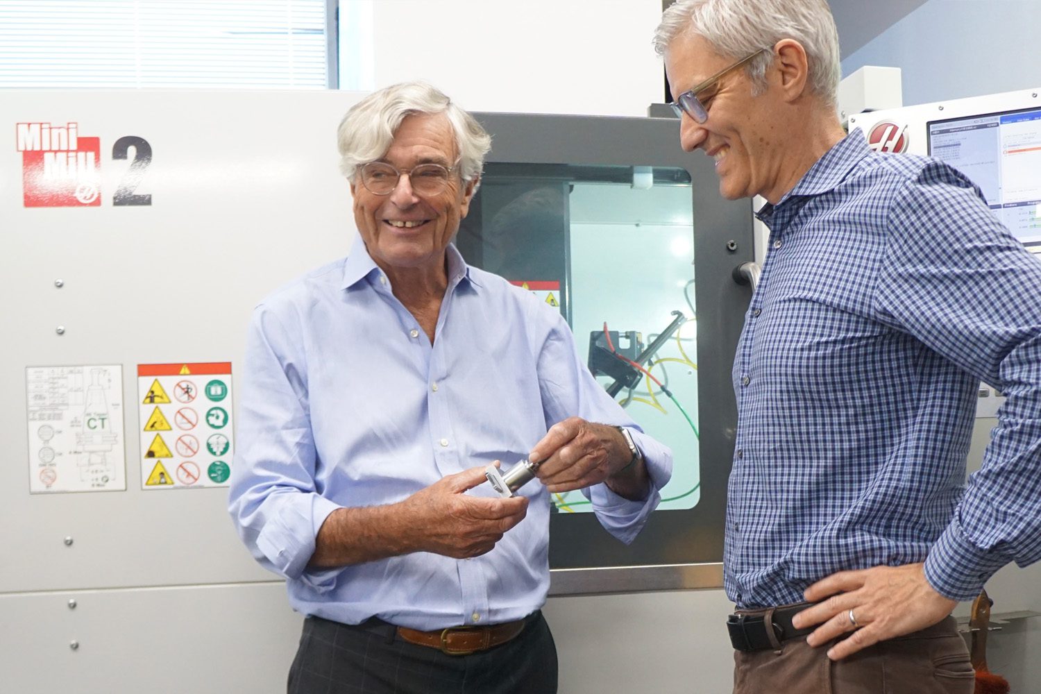 Kenstan Locks - two men discussing and holding a lock