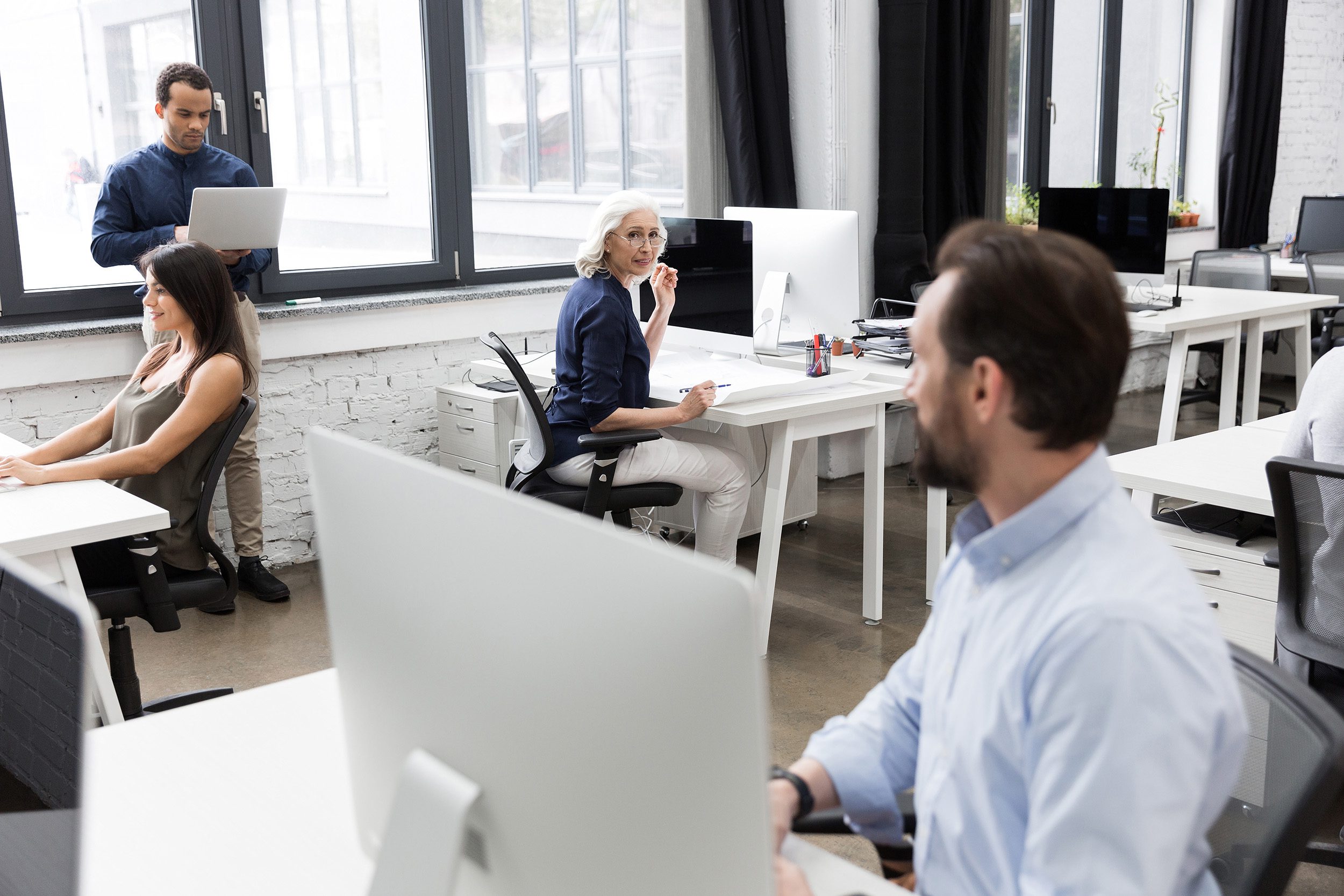 interior view of a modern office with people working photo